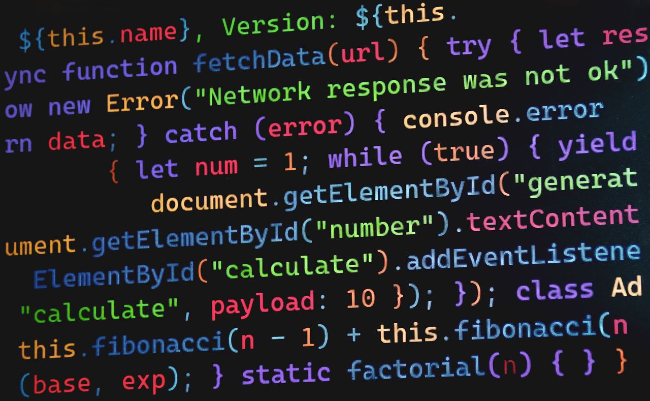 about-us Vibrant JavaScript code displayed on a screen, highlighting programming concepts and software development.